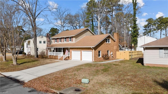 view of front of property with a porch, a garage, and a front lawn