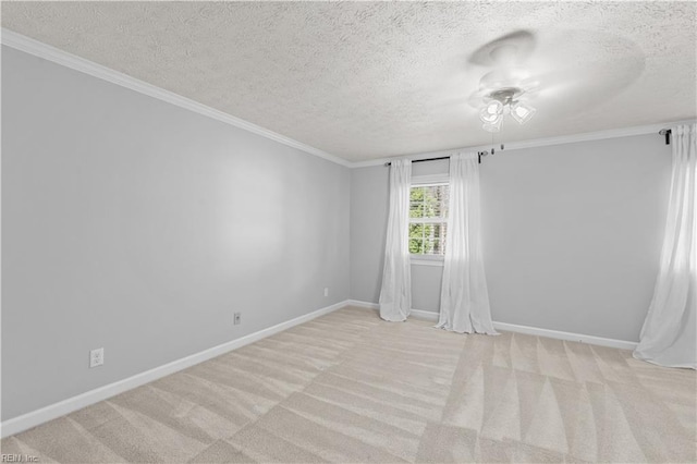 unfurnished room featuring ornamental molding, light colored carpet, and a textured ceiling