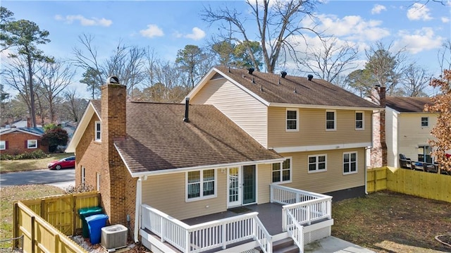 back of house with central AC and a deck