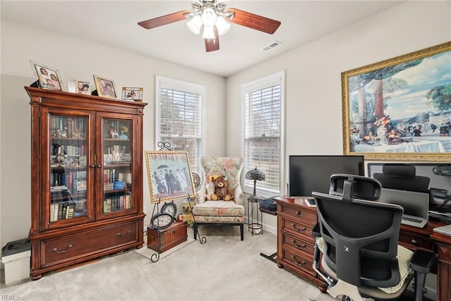 office featuring light colored carpet and ceiling fan