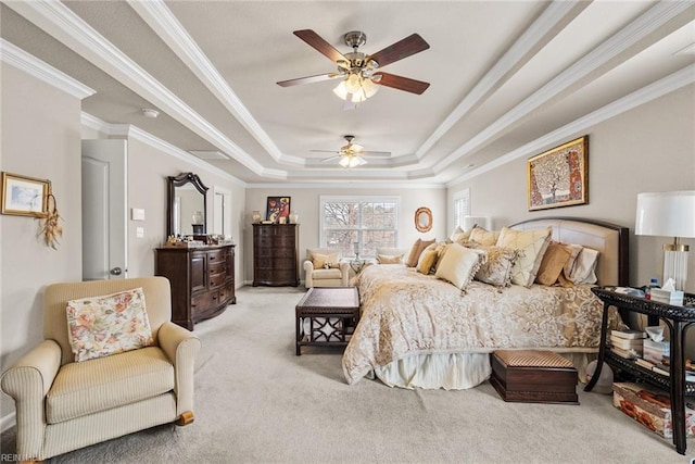 bedroom featuring light carpet, a tray ceiling, ornamental molding, and ceiling fan