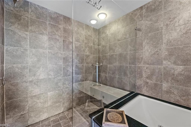 bathroom with separate shower and tub