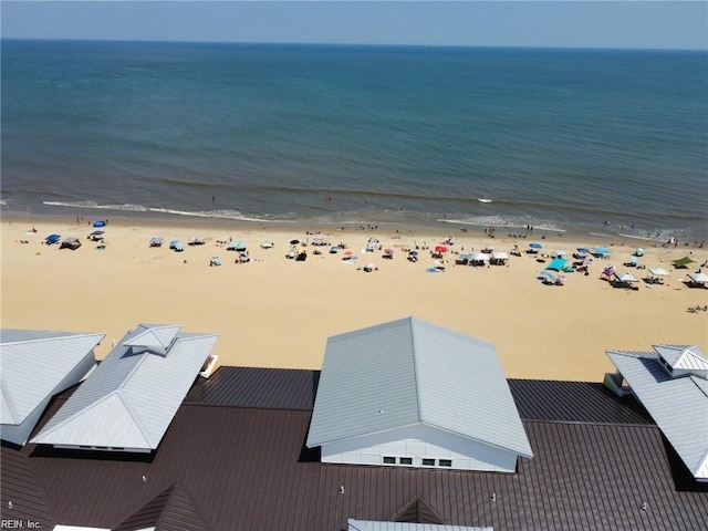 drone / aerial view featuring a water view and a beach view