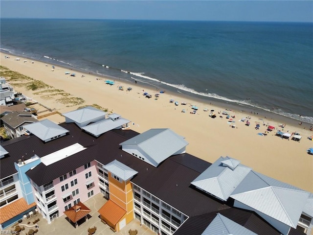 drone / aerial view featuring a view of the beach and a water view