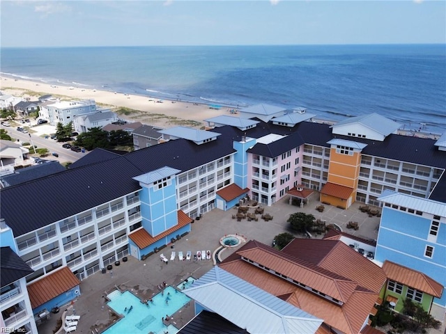 bird's eye view featuring a water view and a view of the beach