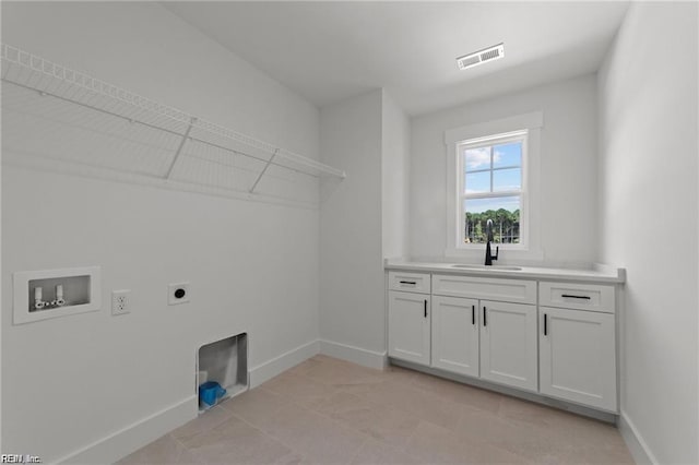 laundry room with cabinets, washer hookup, sink, and hookup for an electric dryer