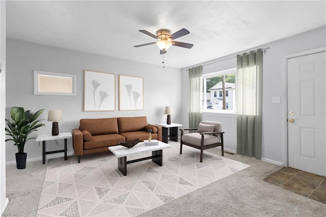 carpeted living room featuring ceiling fan