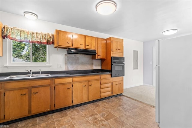 kitchen featuring electric panel, sink, light carpet, and black appliances