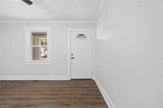 entrance foyer with dark hardwood / wood-style flooring and crown molding