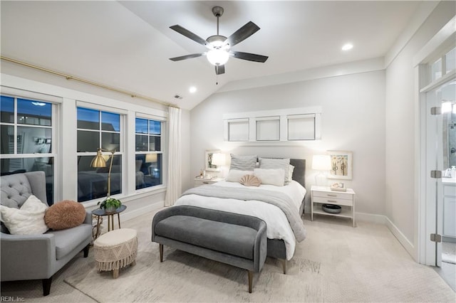 carpeted bedroom with vaulted ceiling and ceiling fan