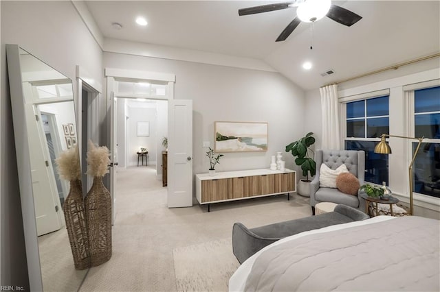 bedroom featuring lofted ceiling, light colored carpet, and ceiling fan