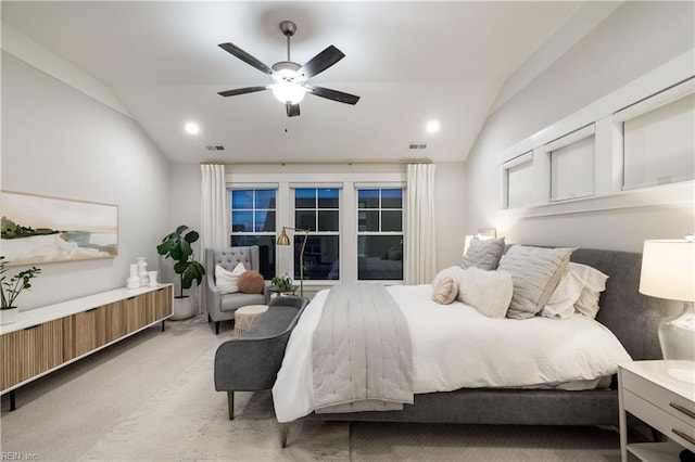 bedroom with lofted ceiling, light colored carpet, and ceiling fan