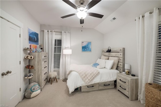 carpeted bedroom with ceiling fan and lofted ceiling