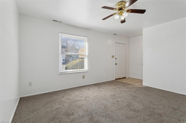 carpeted empty room with ceiling fan