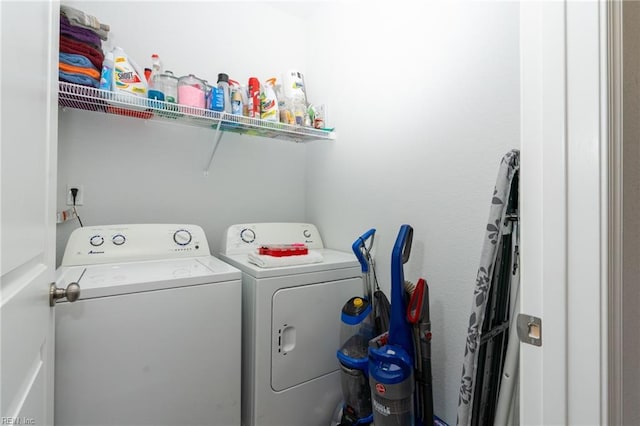 washroom with washing machine and clothes dryer