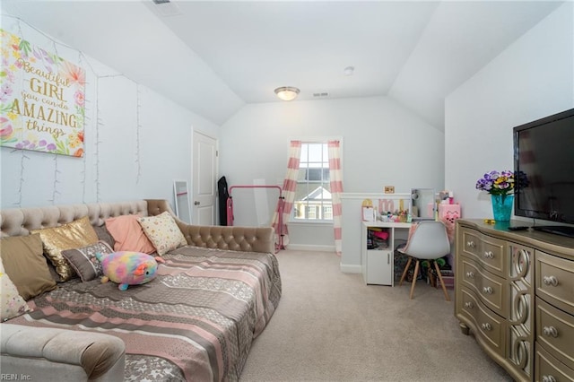 carpeted bedroom with lofted ceiling