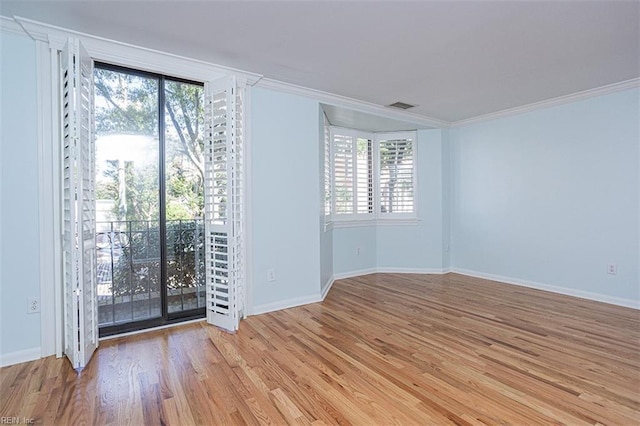 unfurnished room with crown molding and light hardwood / wood-style flooring