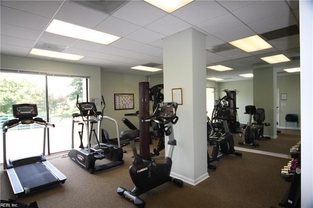 exercise room with a paneled ceiling