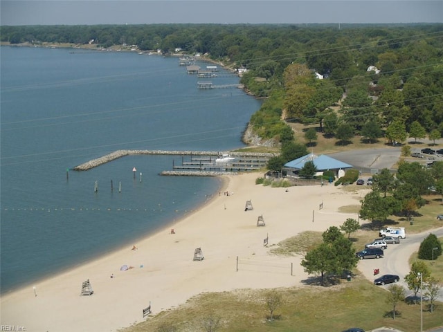 drone / aerial view featuring a water view and a view of the beach