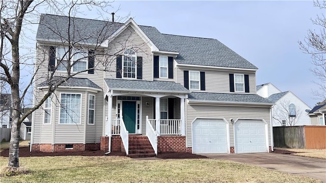 view of front of house featuring a garage and a front yard