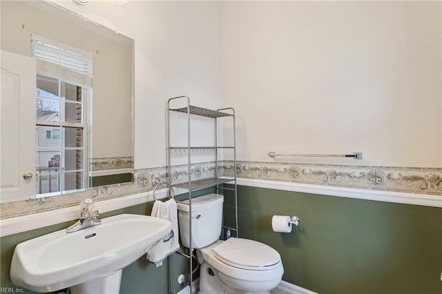 bathroom featuring sink and toilet