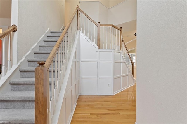 stairs with hardwood / wood-style floors