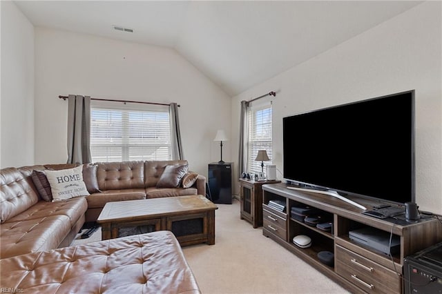 living room with light colored carpet and lofted ceiling