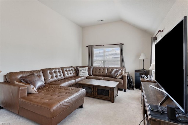 living room with light colored carpet and vaulted ceiling