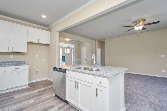 kitchen featuring sink, white cabinetry, light stone counters, a center island with sink, and stainless steel dishwasher