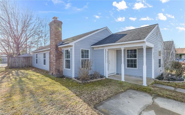 ranch-style home with a patio and a front lawn