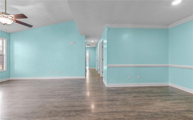 unfurnished room with ornamental molding, dark wood-type flooring, and ceiling fan