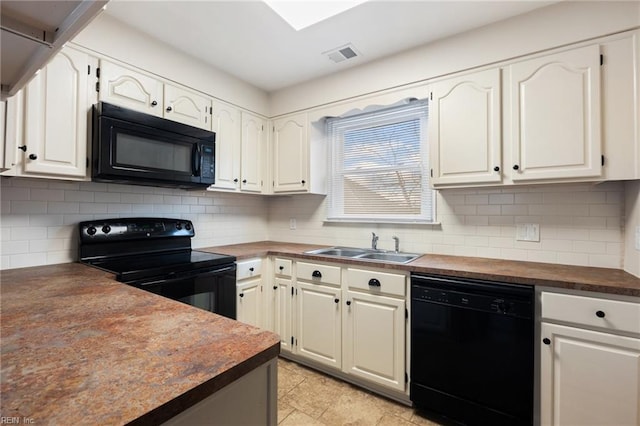 kitchen featuring butcher block counters, sink, black appliances, white cabinets, and backsplash