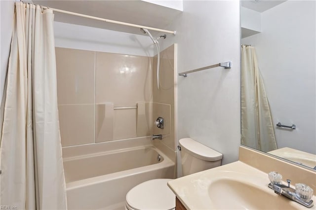 full bathroom with shower / tub combo with curtain, vanity, and toilet