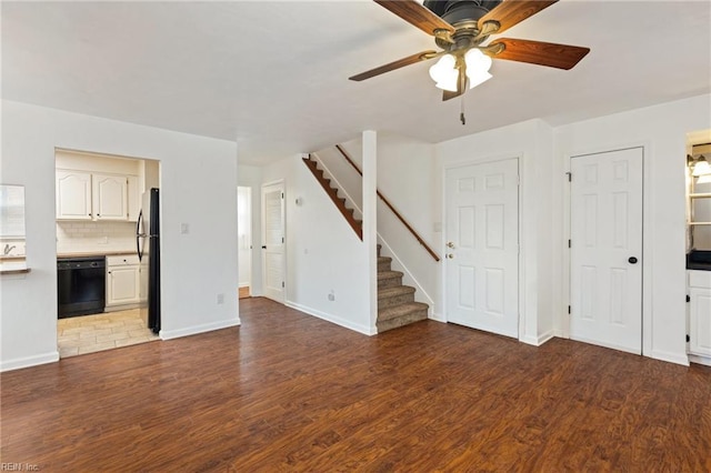 unfurnished living room with hardwood / wood-style floors and ceiling fan