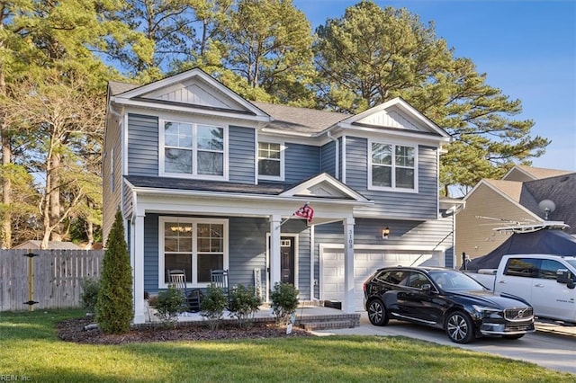 view of front of house featuring a garage, covered porch, and a front lawn