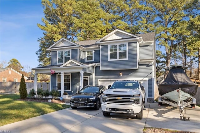 view of front of house featuring a garage and a front lawn