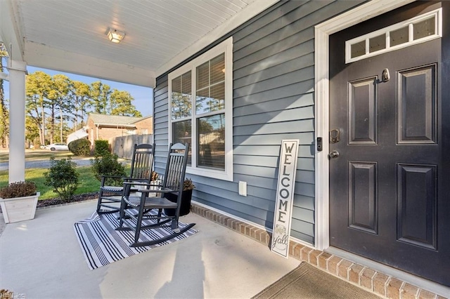 doorway to property with covered porch