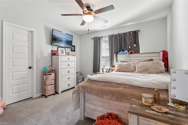 bedroom featuring ceiling fan and carpet