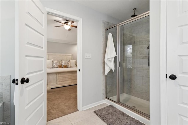 bathroom featuring a shower with door, tile patterned floors, and ceiling fan