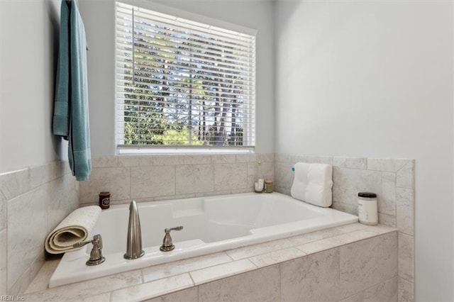 bathroom featuring tiled tub