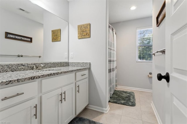 bathroom with vanity and tile patterned flooring