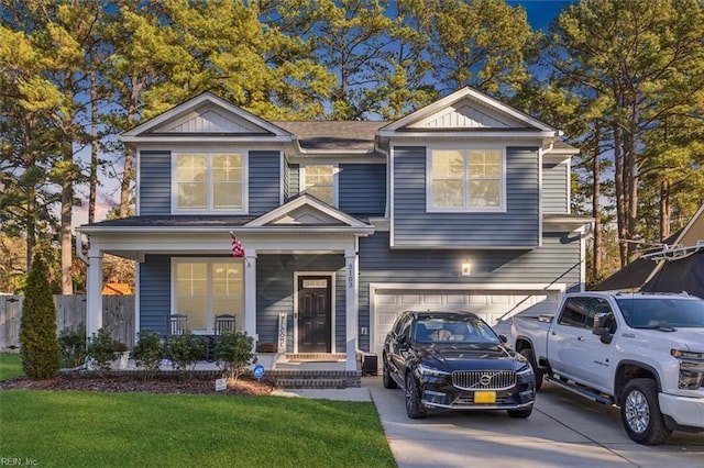 view of front of home featuring a garage and a front lawn