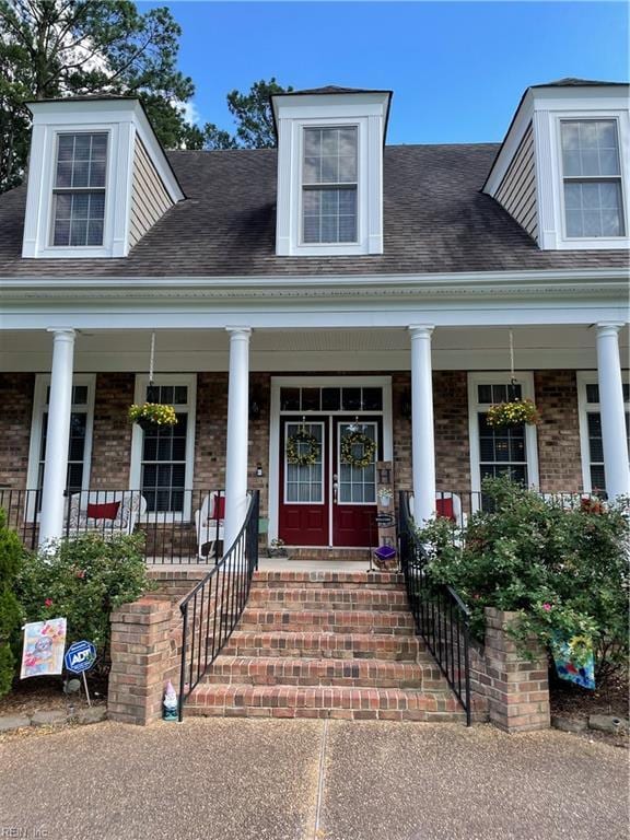 entrance to property featuring covered porch