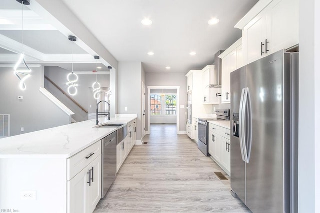 1829 Broadstreet Rd, Hampton, VA 23666 - kitchen featuring stainless steel appliances, a sink, wall chimney range hood, white cabinets, and recessed lighting