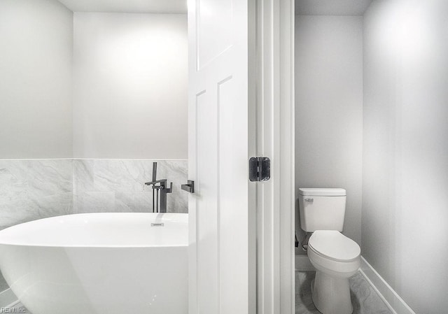 1829 Broadstreet Rd, Hampton, VA 23666 - bathroom with a soaking tub, toilet, and baseboards