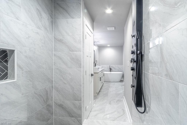 1829 Broadstreet Rd, Hampton, VA 23666 - bathroom featuring vanity, marble look tiles, a freestanding tub, tile walls, and a tile shower