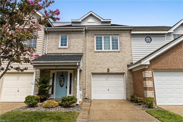 townhome / multi-family property featuring a garage