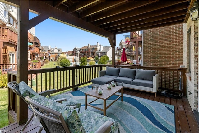 wooden deck featuring an outdoor hangout area