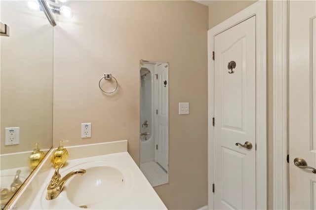 bathroom featuring vanity and a tub