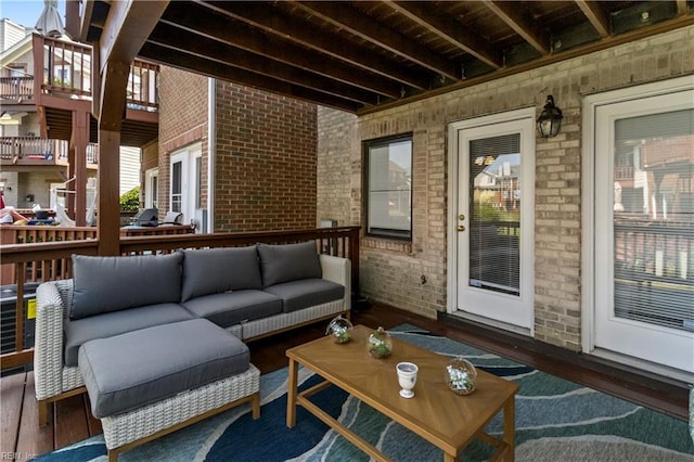 wooden deck with outdoor lounge area